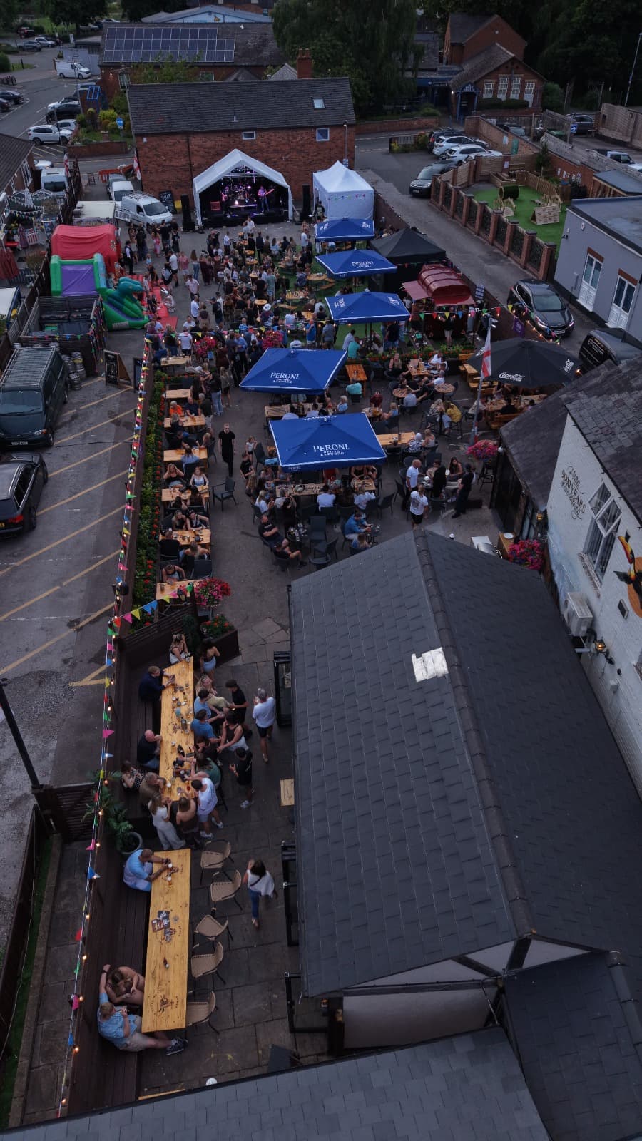 Aerial drone view of an outdoor live music event
