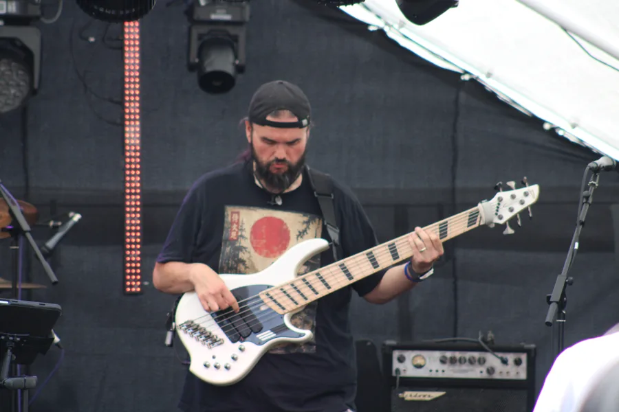 Bassist on outdoor stage