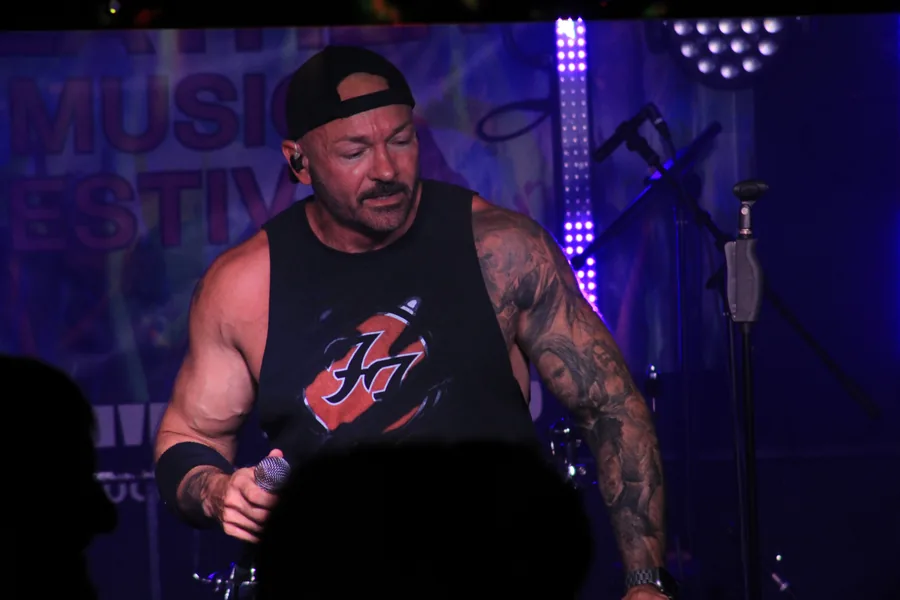 Performer under purple side lighting